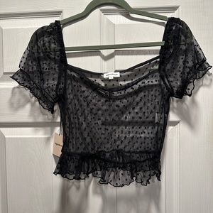 Super down black sheer short sleeve top. Dress up or down. Cute with jeans.